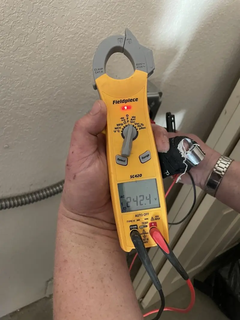 Voltage testing with clamp meter during Outlet Installation in Huntingtown